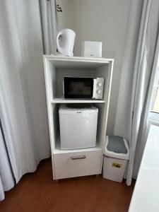 Kuchyň nebo kuchyňský kout v ubytování Palmar Rooms