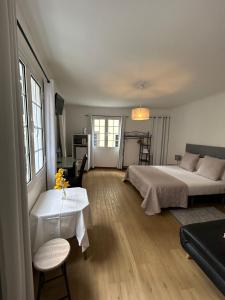 Postel nebo postele na pokoji v ubytování Palmar Rooms