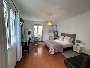 Postel nebo postele na pokoji v ubytování Palmar Rooms