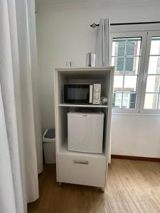 Kuchyň nebo kuchyňský kout v ubytování Palmar Rooms