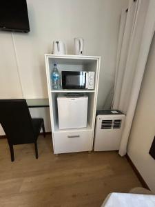 Kuchyň nebo kuchyňský kout v ubytování Palmar Rooms