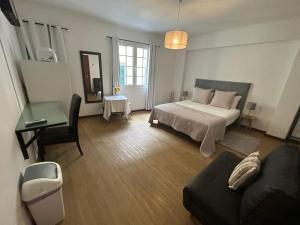 Postel nebo postele na pokoji v ubytování Palmar Rooms