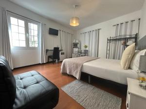 Postel nebo postele na pokoji v ubytování Palmar Rooms