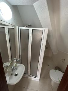 Koupelna v ubytování Palmar Rooms