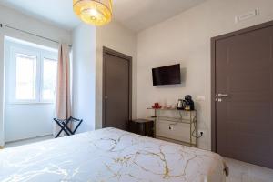 TV a/nebo společenská místnost v ubytování Malva Rooms