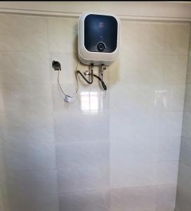 a television on the wall of a bathroom at 3 Bedroom Apartment in Lekki in Lekki