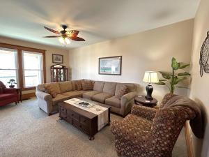 a living room with a couch and a table at Lady Mary Angeline in Saint Ignace