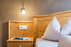 Ένα ή περισσότερα κρεβάτια σε δωμάτιο στο Ronsolhof Ortler