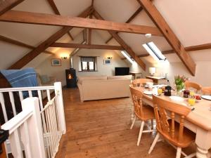 a dining room and living room with a table and chairs at 3 Bed in Bude CORYM in Morwenstow