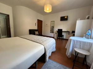 Postel nebo postele na pokoji v ubytování Palmar Rooms
