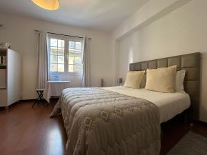 Postel nebo postele na pokoji v ubytování Palmar Rooms