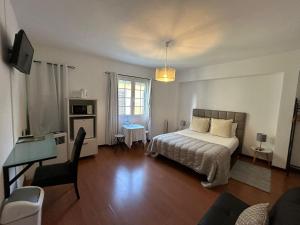 Postel nebo postele na pokoji v ubytování Palmar Rooms