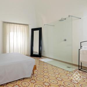 Łóżko lub łóżka w pokoju w obiekcie Villa Aurelia - guesthouse Le Case di Aurelia