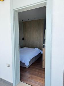 Postel nebo postele na pokoji v ubytování Luciano Hotel