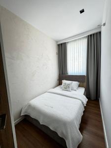 Postel nebo postele na pokoji v ubytování Luciano Hotel