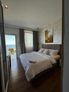 Postel nebo postele na pokoji v ubytování Luciano Hotel