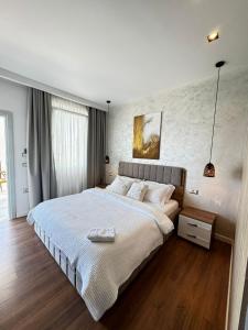 Postel nebo postele na pokoji v ubytování Luciano Hotel + 10 fotografií