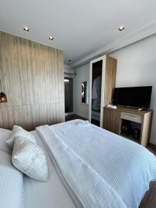 Postel nebo postele na pokoji v ubytování Luciano Hotel