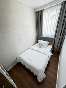Postel nebo postele na pokoji v ubytování Luciano Hotel