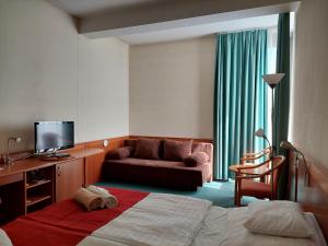 TV a/nebo společenská místnost v ubytování Hunguest Hotel Aqua Sol