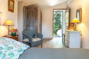 Ένα ή περισσότερα κρεβάτια σε δωμάτιο στο Pieds dans l'eau à Plage des Dames