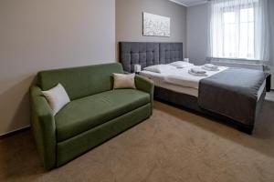 Łóżko lub łóżka w pokoju w obiekcie Relax Hotel Stork