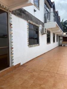an outside view of a building with a patio at Rich Court rooms in Oko