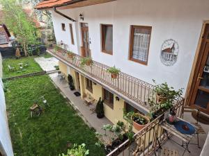an apartment with a balcony with potted plants at Saint John's 22 Brasov in Braşov