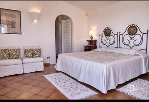 Ένα ή περισσότερα κρεβάτια σε δωμάτιο στο Belocations - Cala di Volpe Luxury Villa +16 φωτογραφίες