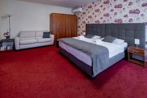 Łóżko lub łóżka w pokoju w obiekcie Relax Hotel Stork