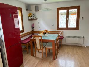 a kitchen with a dining room table and chairs at Green Sky House in Mostec