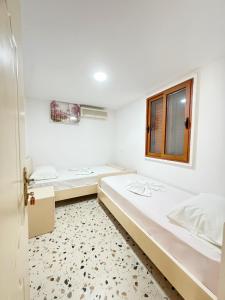 Llit o llits en una habitació de Bellavista Villa