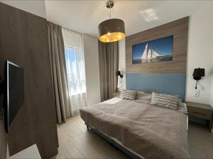 Ένα ή περισσότερα κρεβάτια σε δωμάτιο στο Onyx by Baltic Home