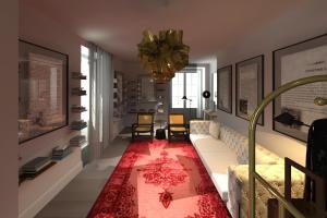 uma sala de estar com um sofá e um tapete vermelho em L Boutique Hotel em Angra do Heroísmo