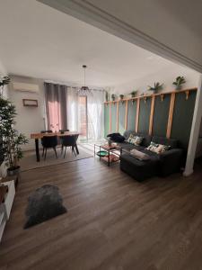 a living room with a couch and a table at Appartement Cosy - Plein centre in Marseille