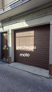 a garage door with the word paracco museo at Casa Holiday Sea Etna Di Enza in Linguaglossa