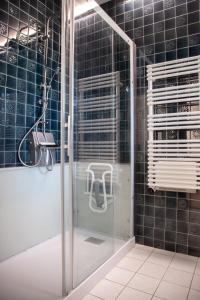 a shower with a glass door in a bathroom at Villa Topaze La Baule les Pins in La Baule