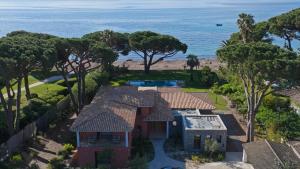 an aerial view of a house with the ocean in the background at Villa Alda in Saint-Tropez