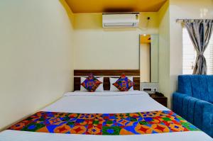 Postel nebo postele na pokoji v ubytování HOTEL KANAN INN