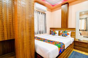 Postel nebo postele na pokoji v ubytování HOTEL KANAN INN