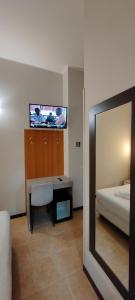 Postel nebo postele na pokoji v ubytování Hotel Nuovo Rondò