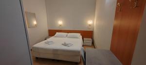 Postel nebo postele na pokoji v ubytování Hotel Nuovo Rondò