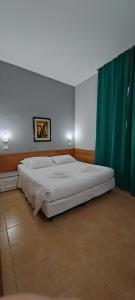 Postel nebo postele na pokoji v ubytování Hotel Nuovo Rondò