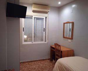 TV a/nebo společenská místnost v ubytování L'Oncle Pere Habitacions