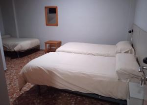 Postel nebo postele na pokoji v ubytování L'Oncle Pere Habitacions