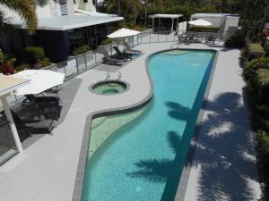 an overhead view of a swimming pool at a resort at The Waterford Prestige Apartments in Caloundra