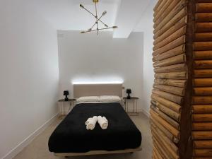 a room with a bed with two elephants on it at Best loft luxury in Madrid center 12 in Madrid
