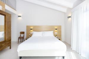 Postel nebo postele na pokoji v ubytování Ros'e Mari Green Home Hotel