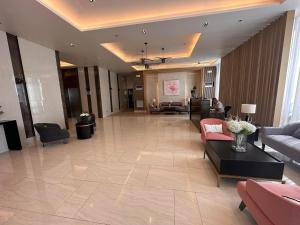 a large living room with couches and a lobby at Paranaque Manila Bloom residences in Manila