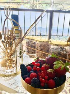 a bowl of fruit is sitting on a table at Dimora del Duomo in Enna +90 photos